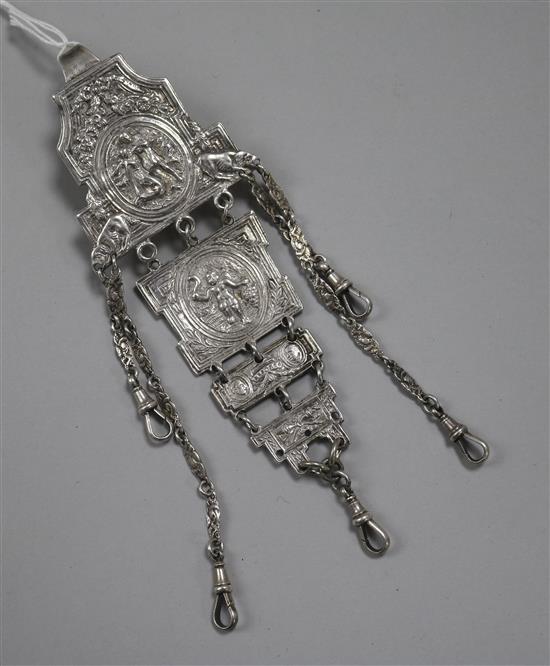 A white metal chatelaine, with four graduating panels, (no accessories).